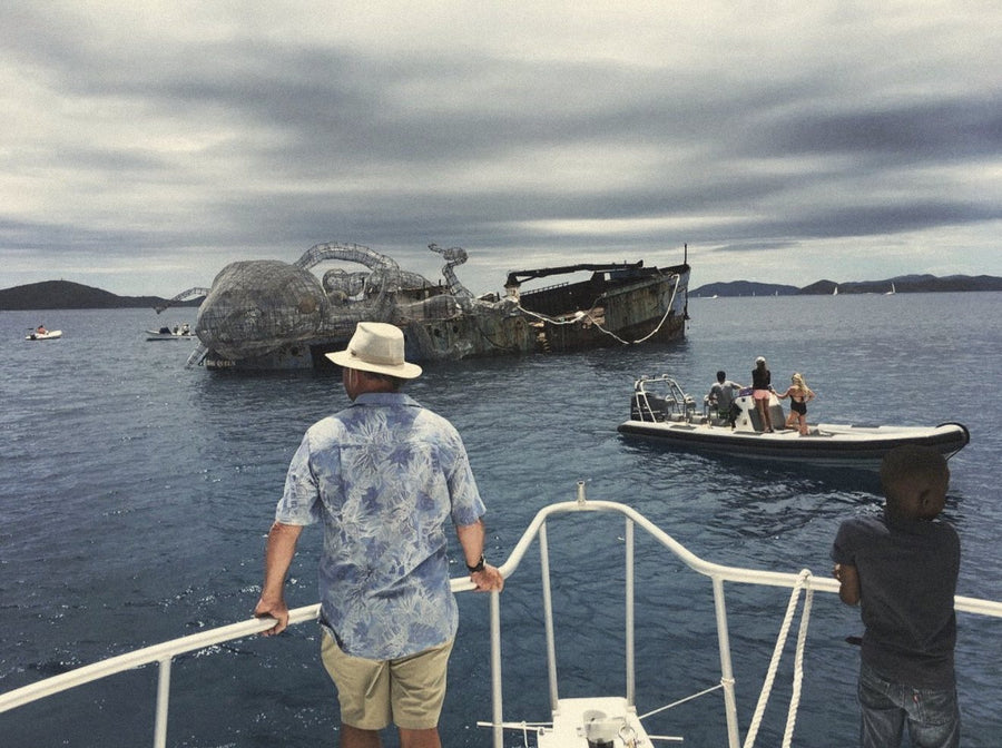 dad at the sinking of a giant kraken squid installed on a shipwreck to make an artificial reef